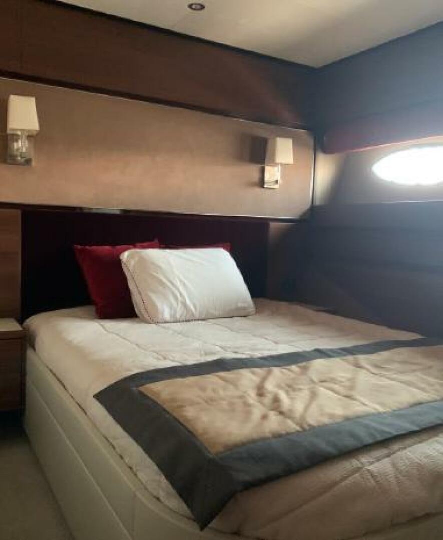 a bed with a pillow and pillows aboard SOLDAYA Yacht for Sale