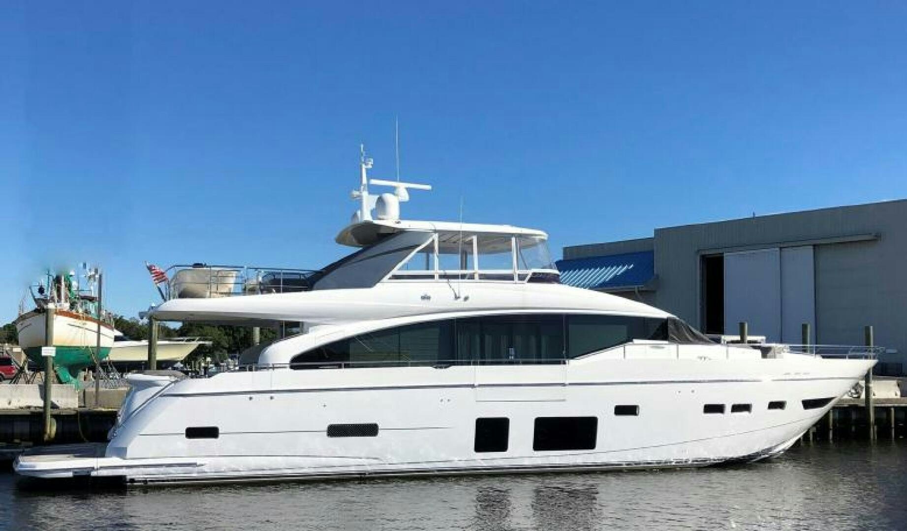 a white yacht in a dock aboard SOLDAYA Yacht for Sale