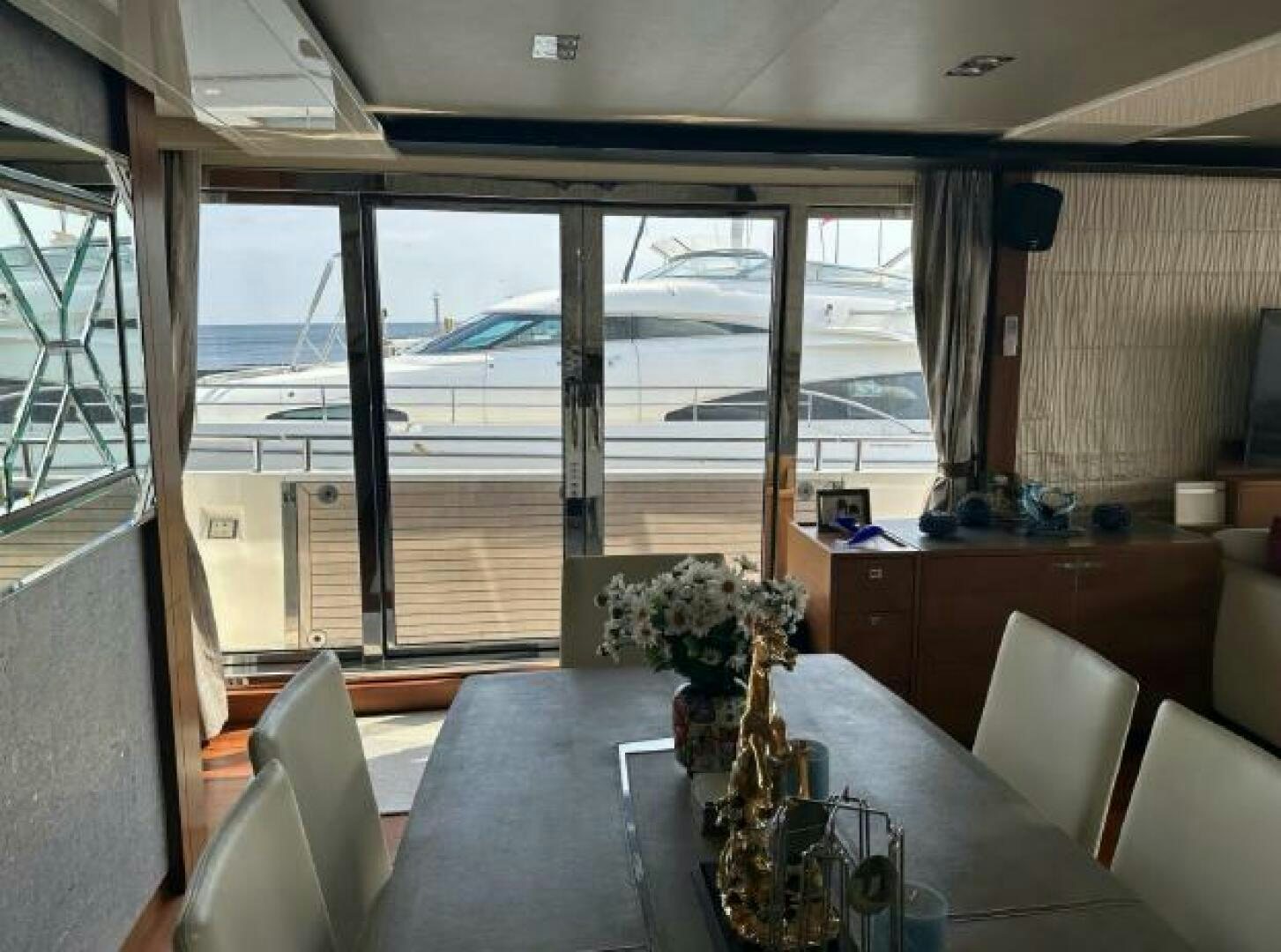 a room with a table and chairs aboard SOLDAYA Yacht for Sale