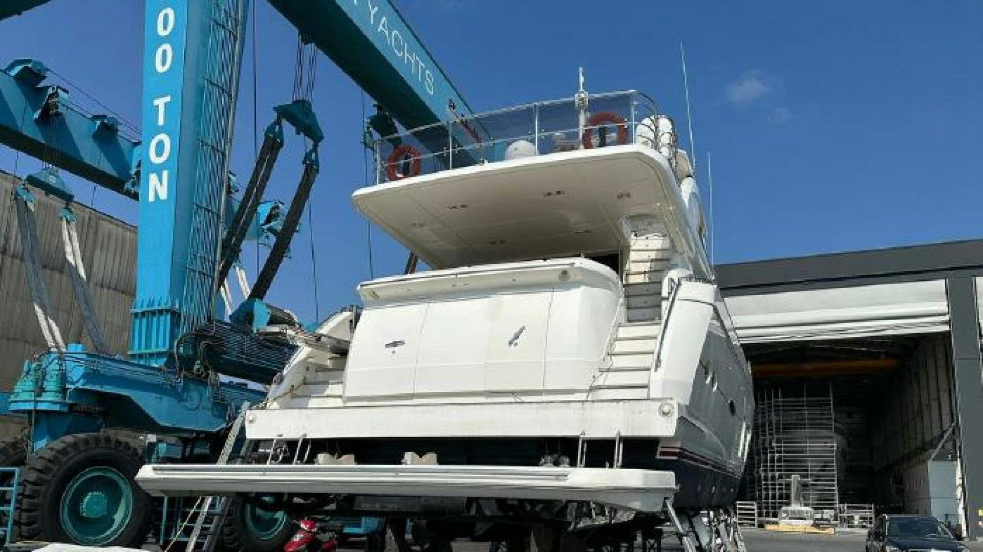 a large white boat on a trailer aboard SOLDAYA Yacht for Sale