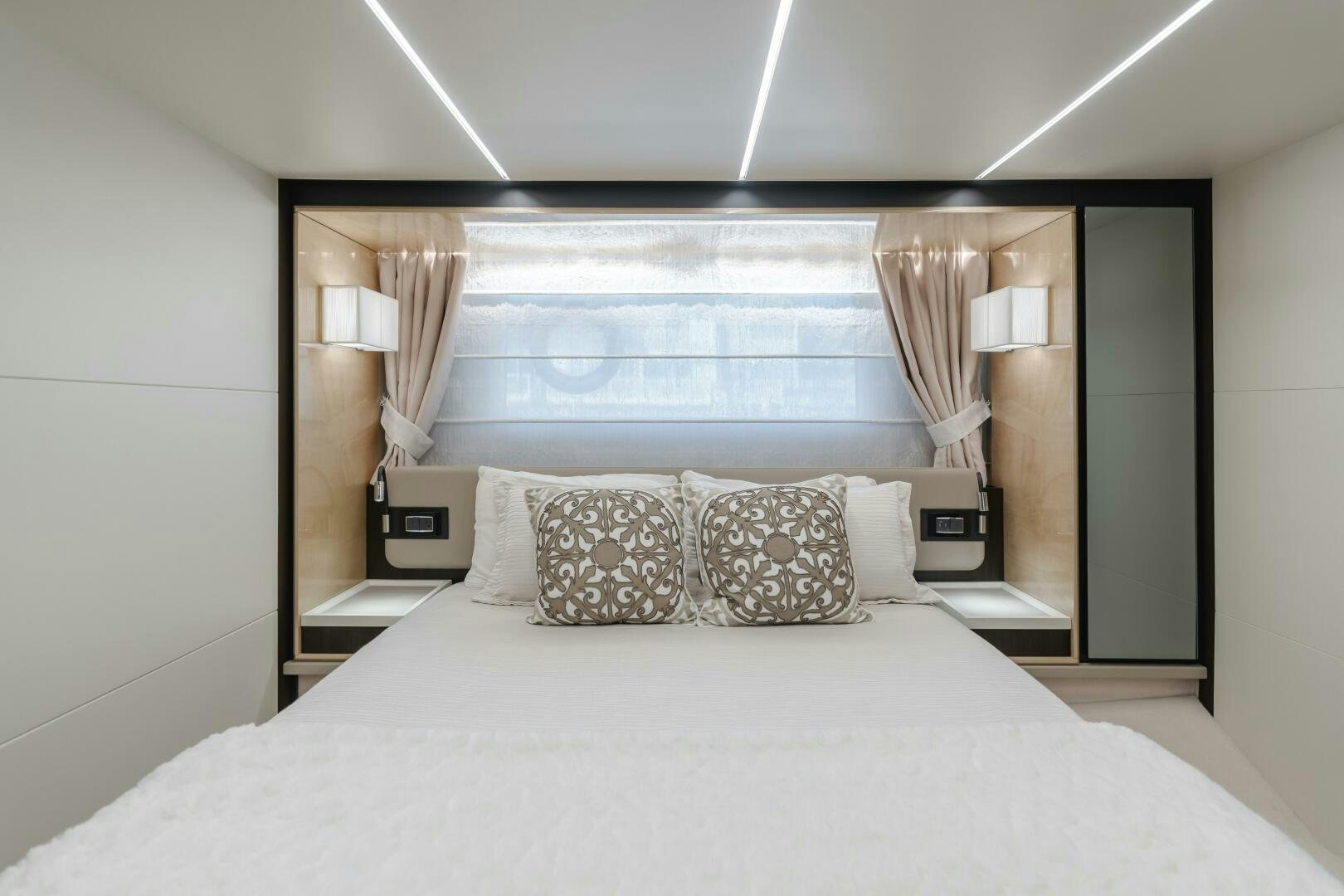 a bed with pillows aboard TCHANTCHES Yacht for Sale