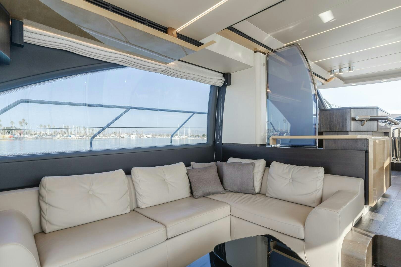 a room with a couch and a window aboard TCHANTCHES Yacht for Sale