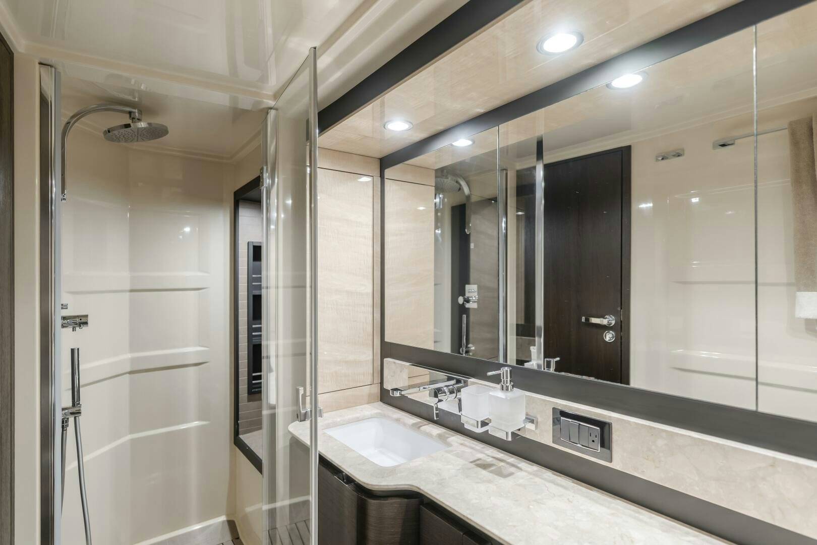 a bathroom with a large mirror aboard TCHANTCHES Yacht for Sale