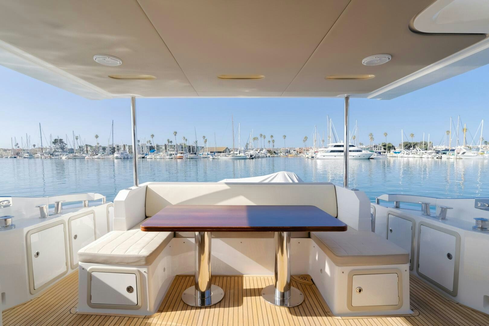 a pool with a table and chairs aboard TCHANTCHES Yacht for Sale