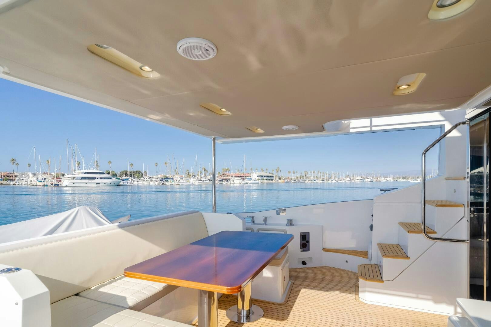 a room with a table and chairs aboard TCHANTCHES Yacht for Sale