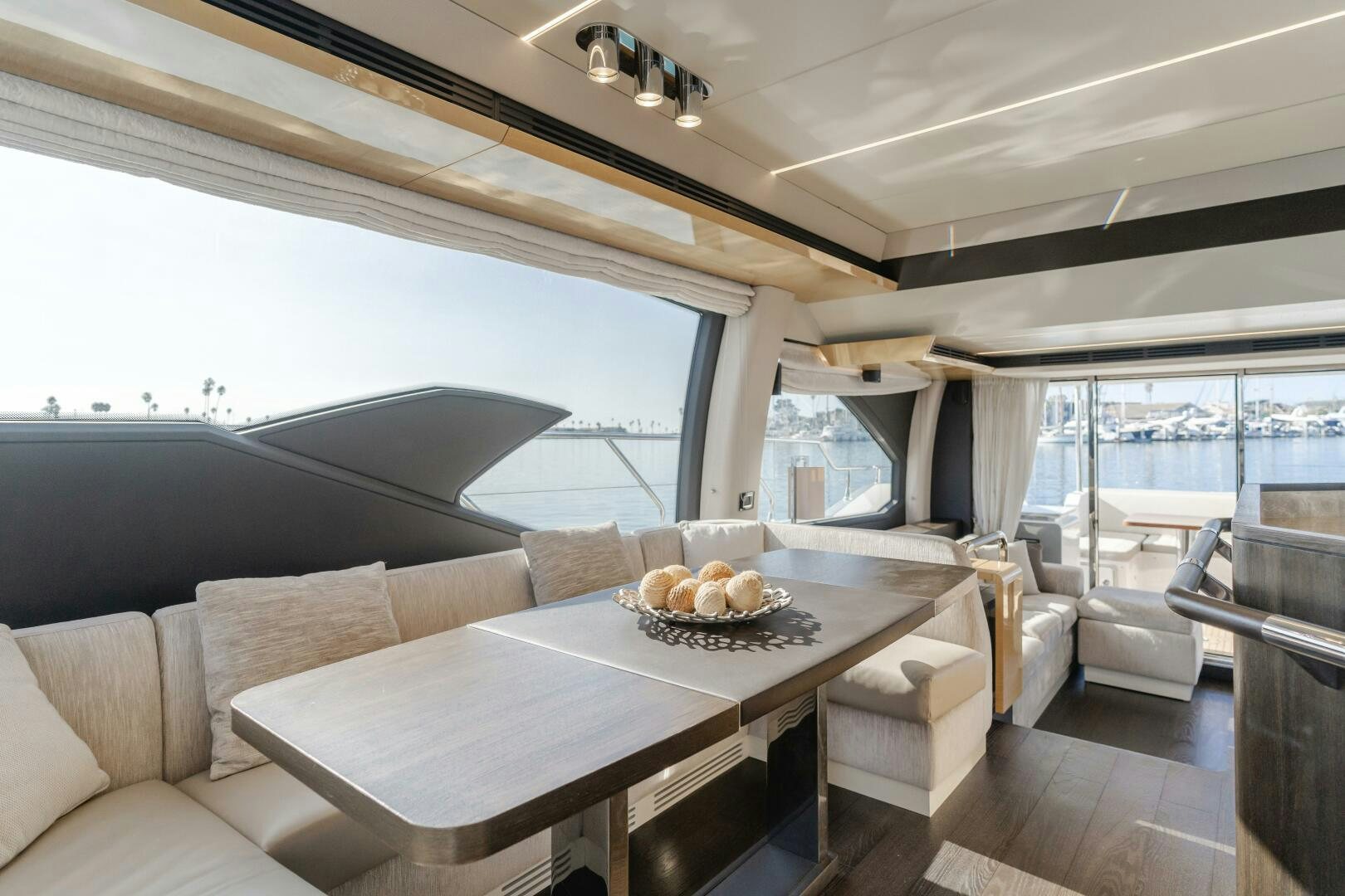 a room with a table and chairs aboard TCHANTCHES Yacht for Sale