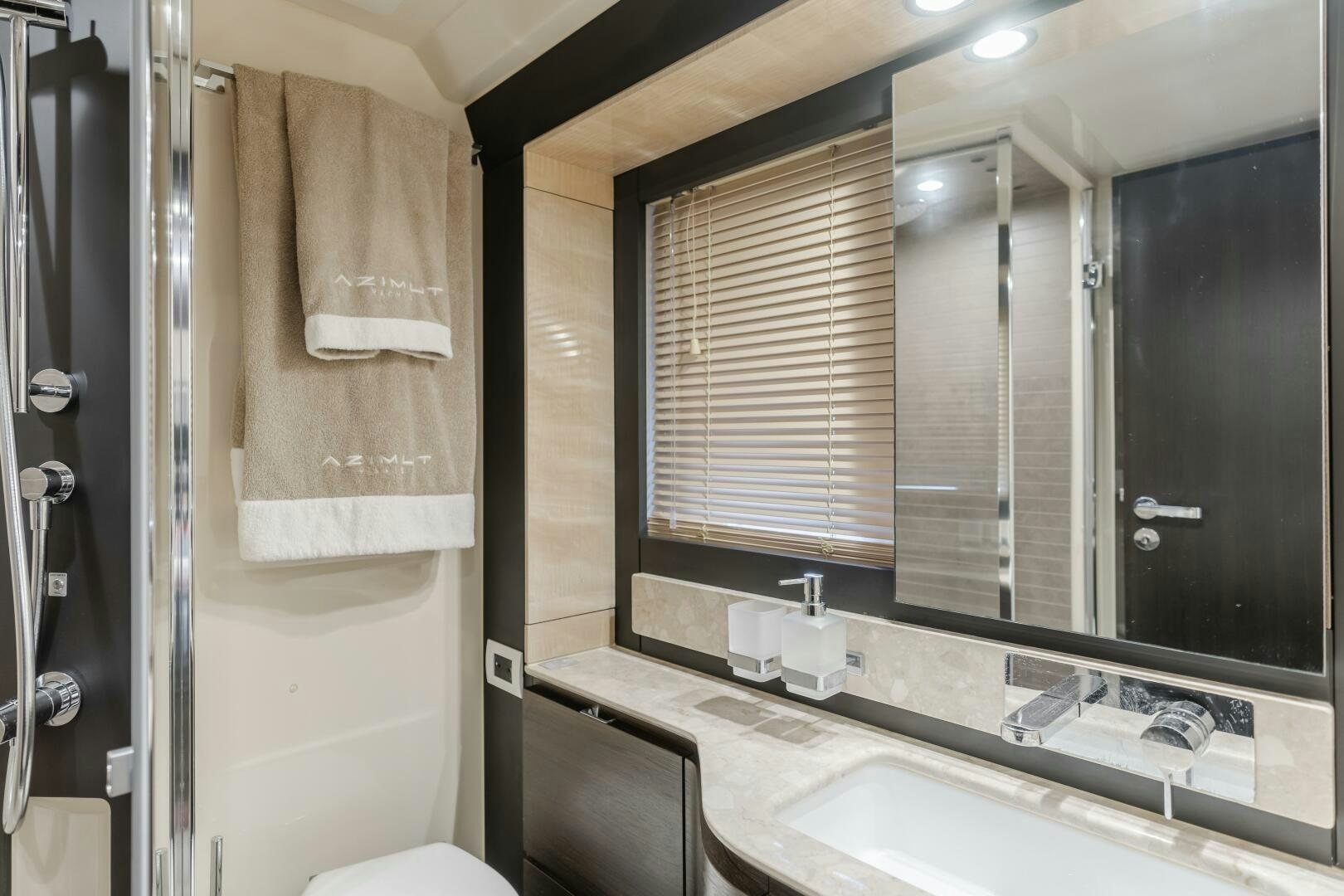 a bathroom with a large mirror aboard TCHANTCHES Yacht for Sale