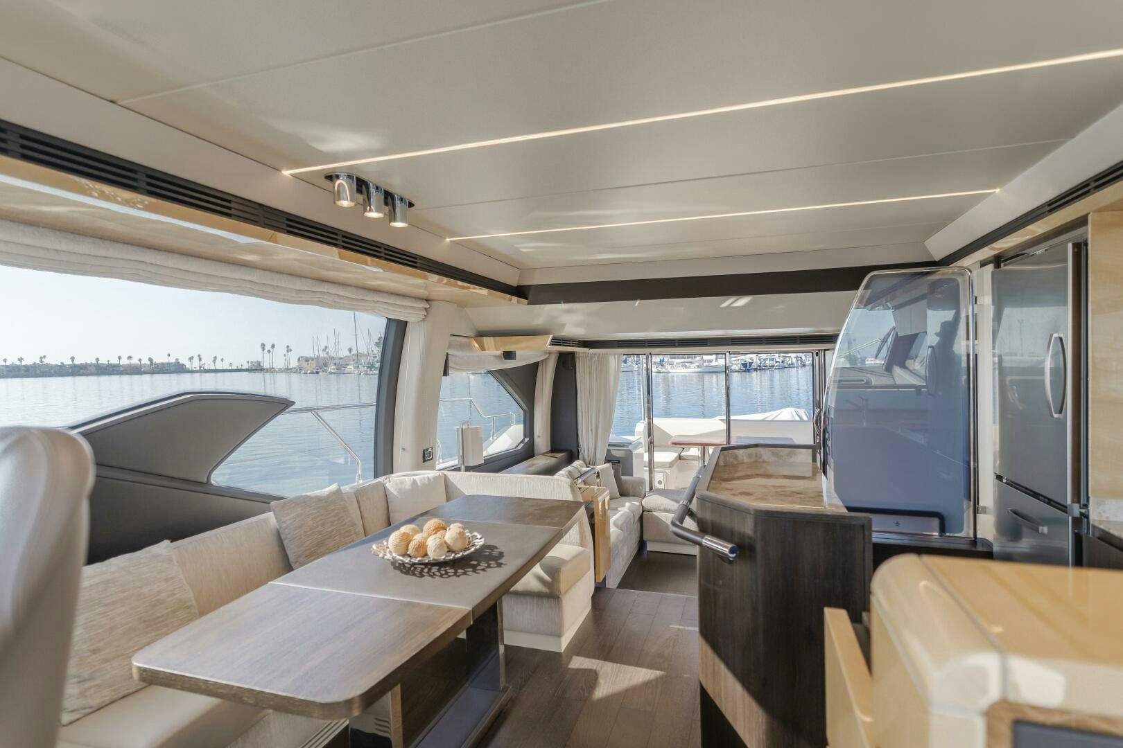 a room with a table and chairs aboard TCHANTCHES Yacht for Sale