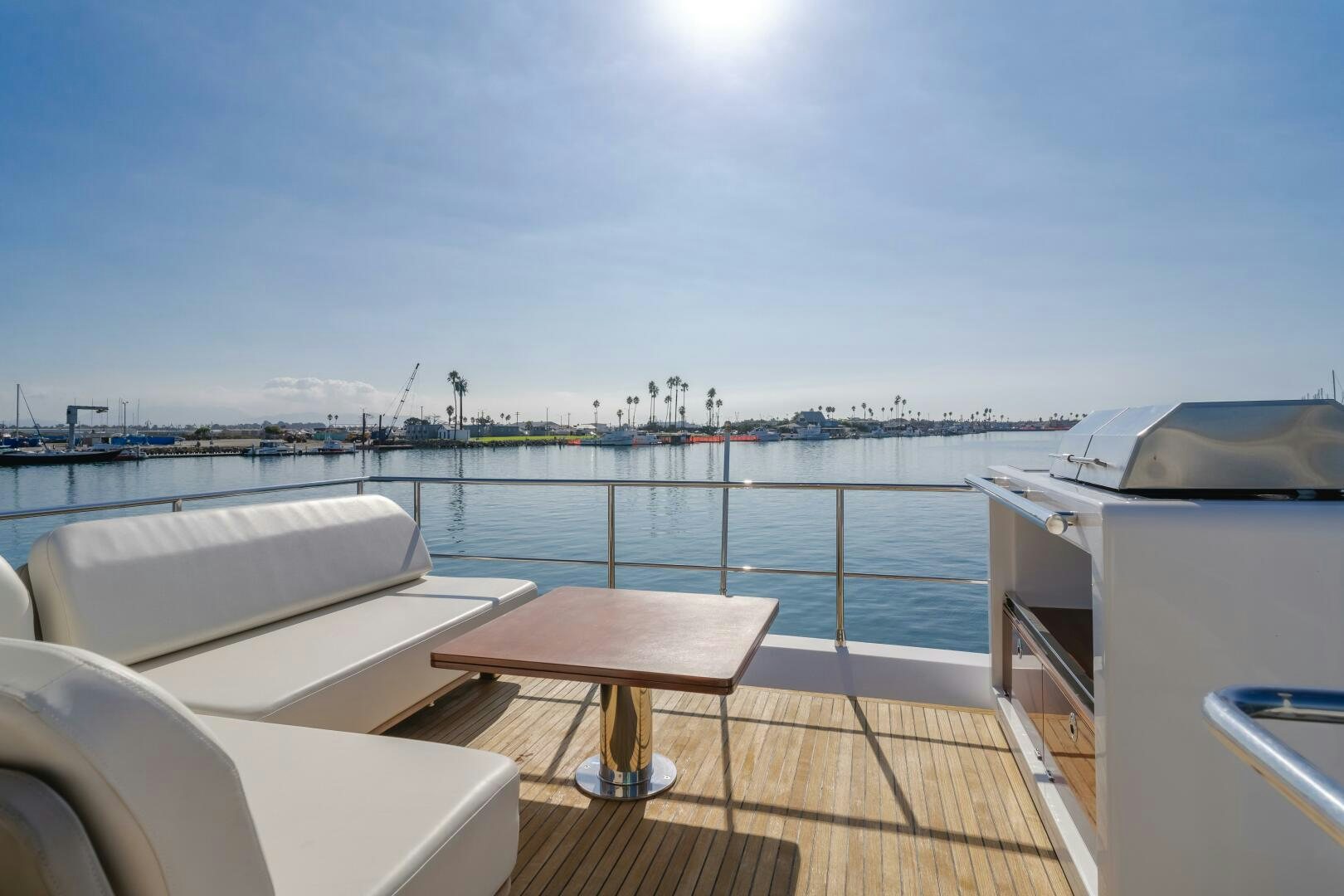 a deck with a view of a city and water aboard TCHANTCHES Yacht for Sale