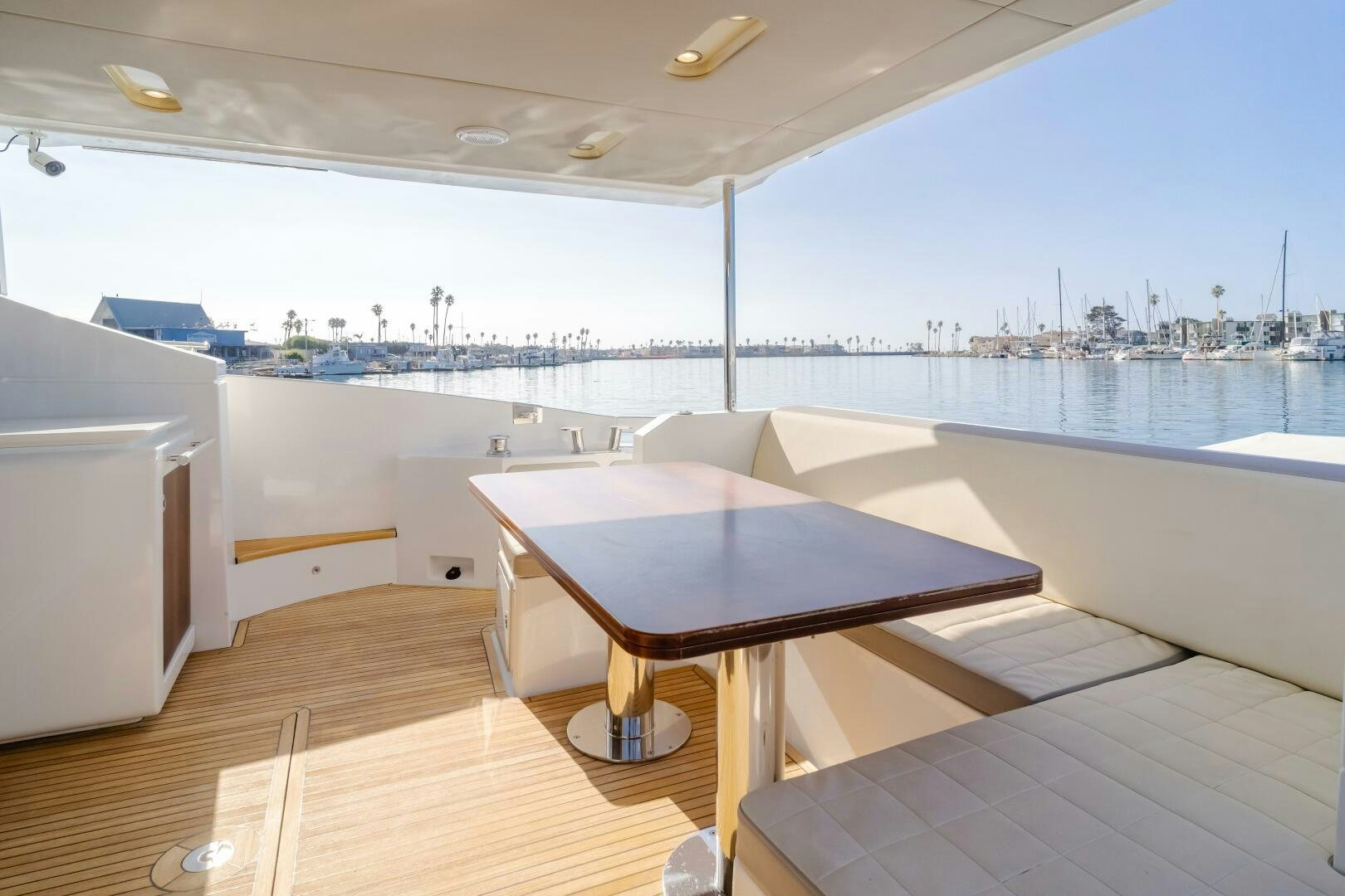 a room with a table and chairs aboard TCHANTCHES Yacht for Sale