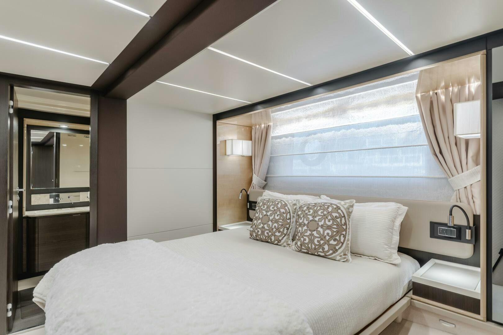 a bed with pillows aboard TCHANTCHES Yacht for Sale