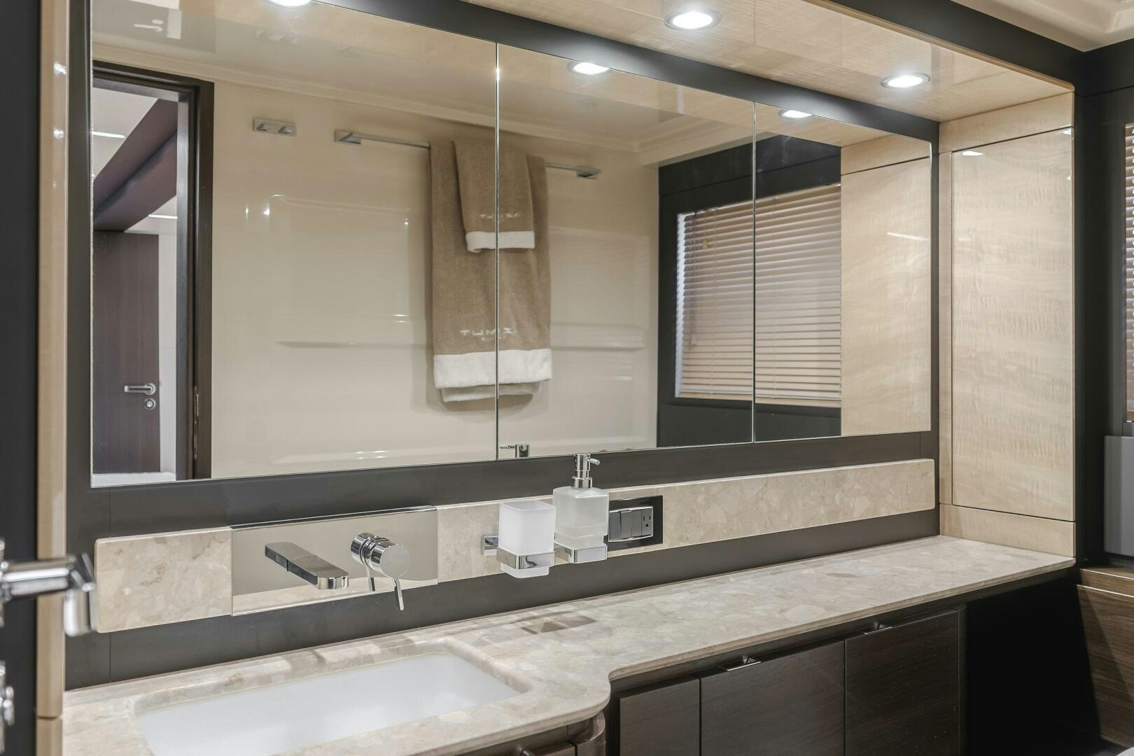a bathroom with a large mirror aboard TCHANTCHES Yacht for Sale