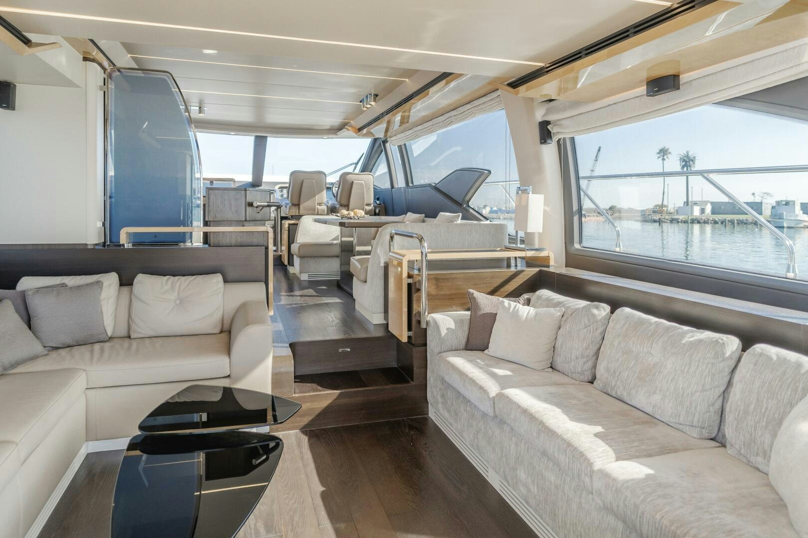 a living room with a couch and a table aboard TCHANTCHES Yacht for Sale
