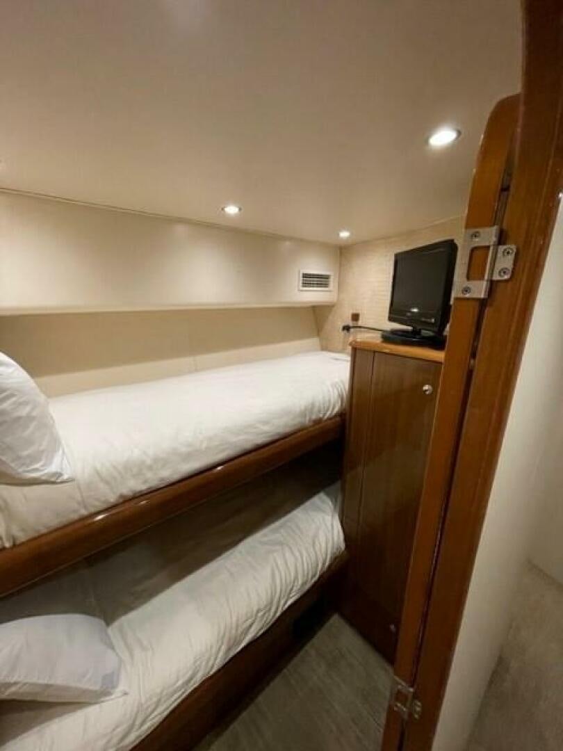 a hotel room with two beds aboard 6 C Yacht for Sale