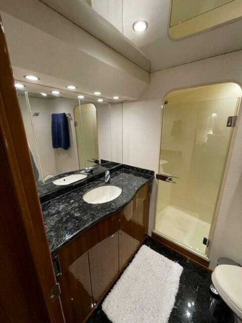 a bathroom with a black countertop aboard 6 C Yacht for Sale