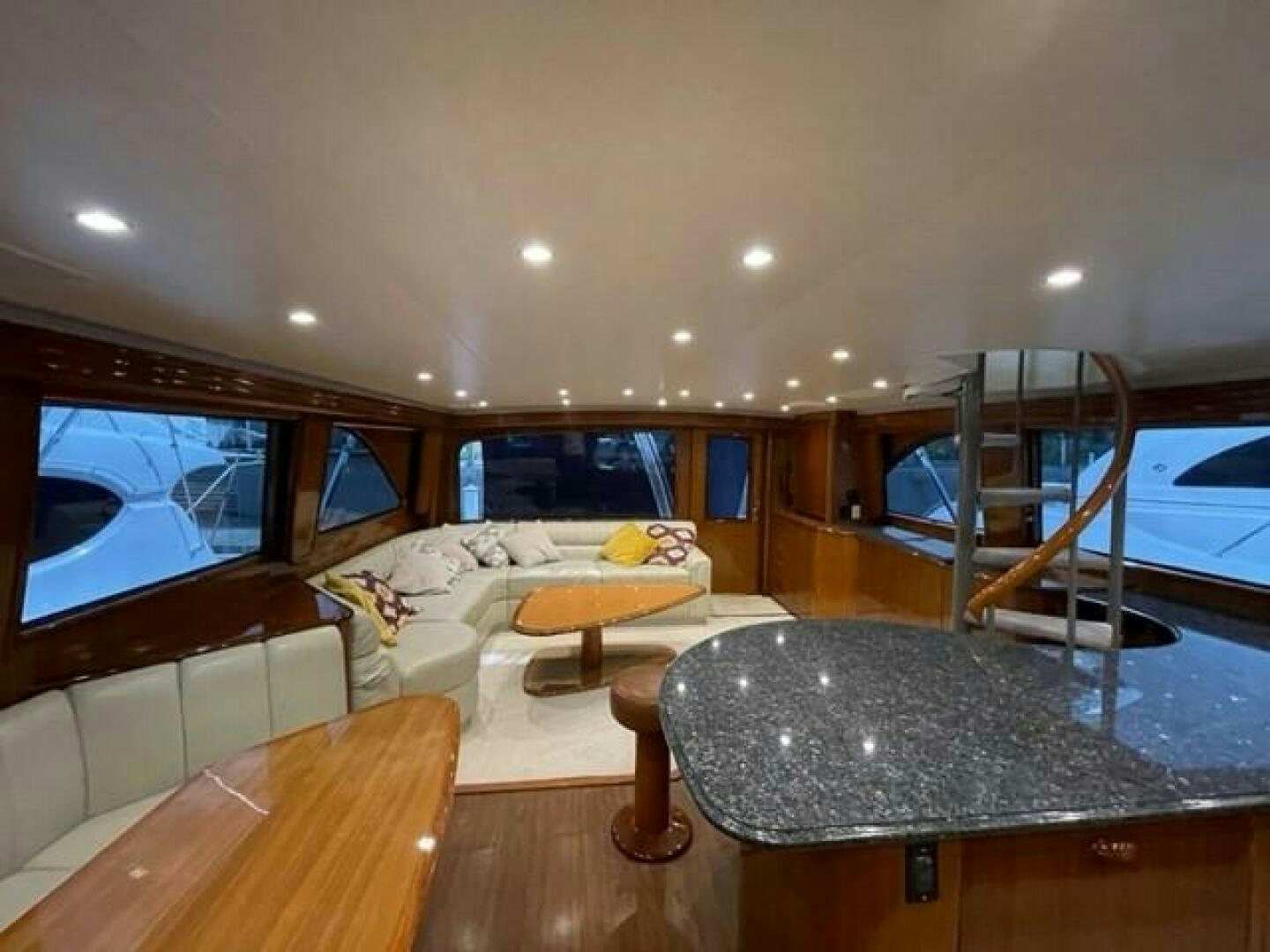 a living room with a large tv aboard 6 C Yacht for Sale