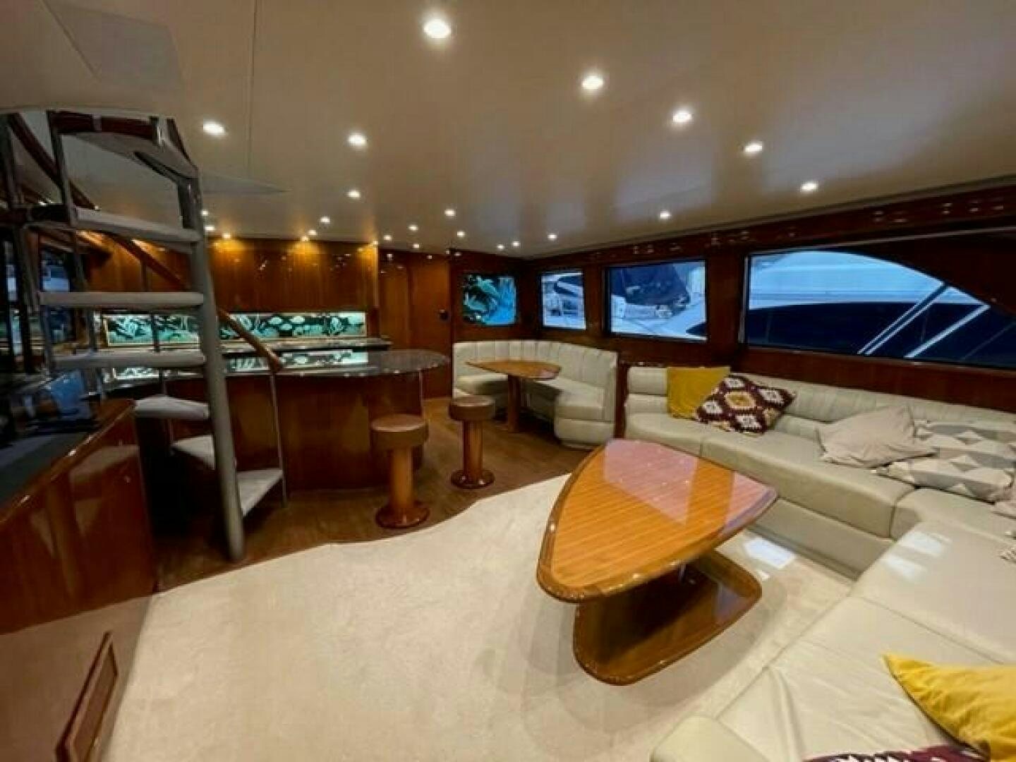 a room with a couch and a table aboard 6 C Yacht for Sale
