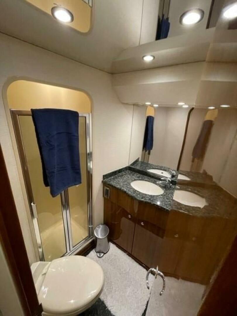 a bathroom with a sink and a mirror aboard 6 C Yacht for Sale