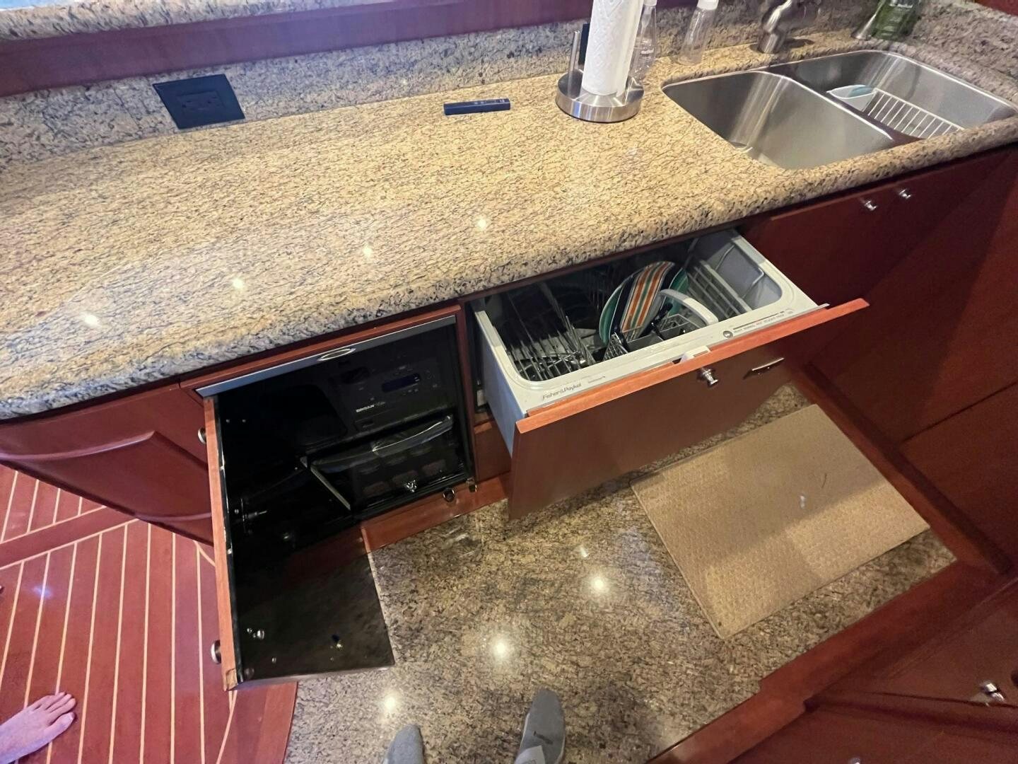 a kitchen with a sink and cabinets aboard SIG:PRN Yacht for Sale