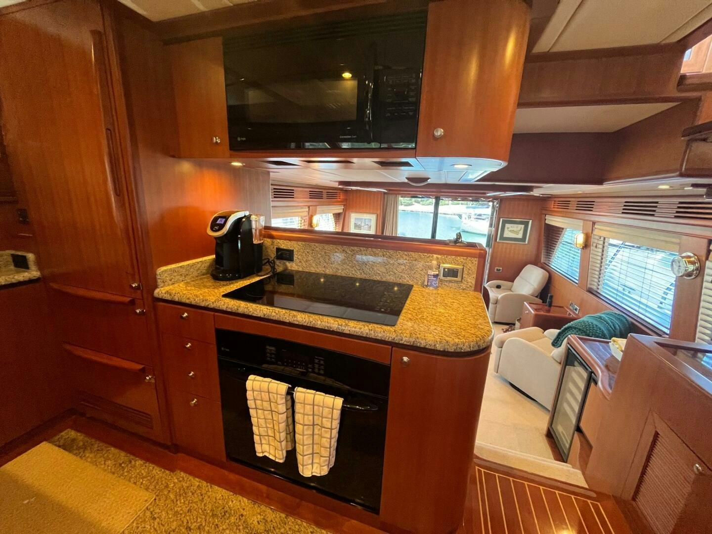 a kitchen with a sink and a couch aboard SIG:PRN Yacht for Sale