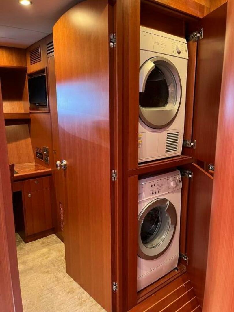 a washer and dryer in a room aboard SIG:PRN Yacht for Sale