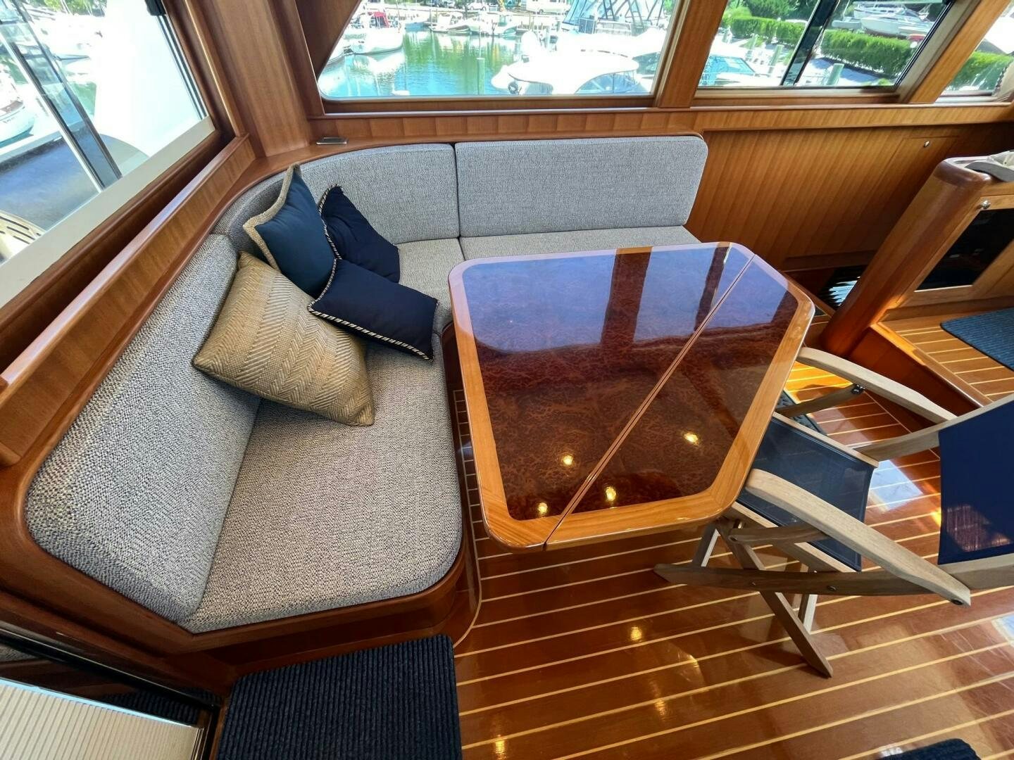 a couch and chairs in a room aboard SIG:PRN Yacht for Sale