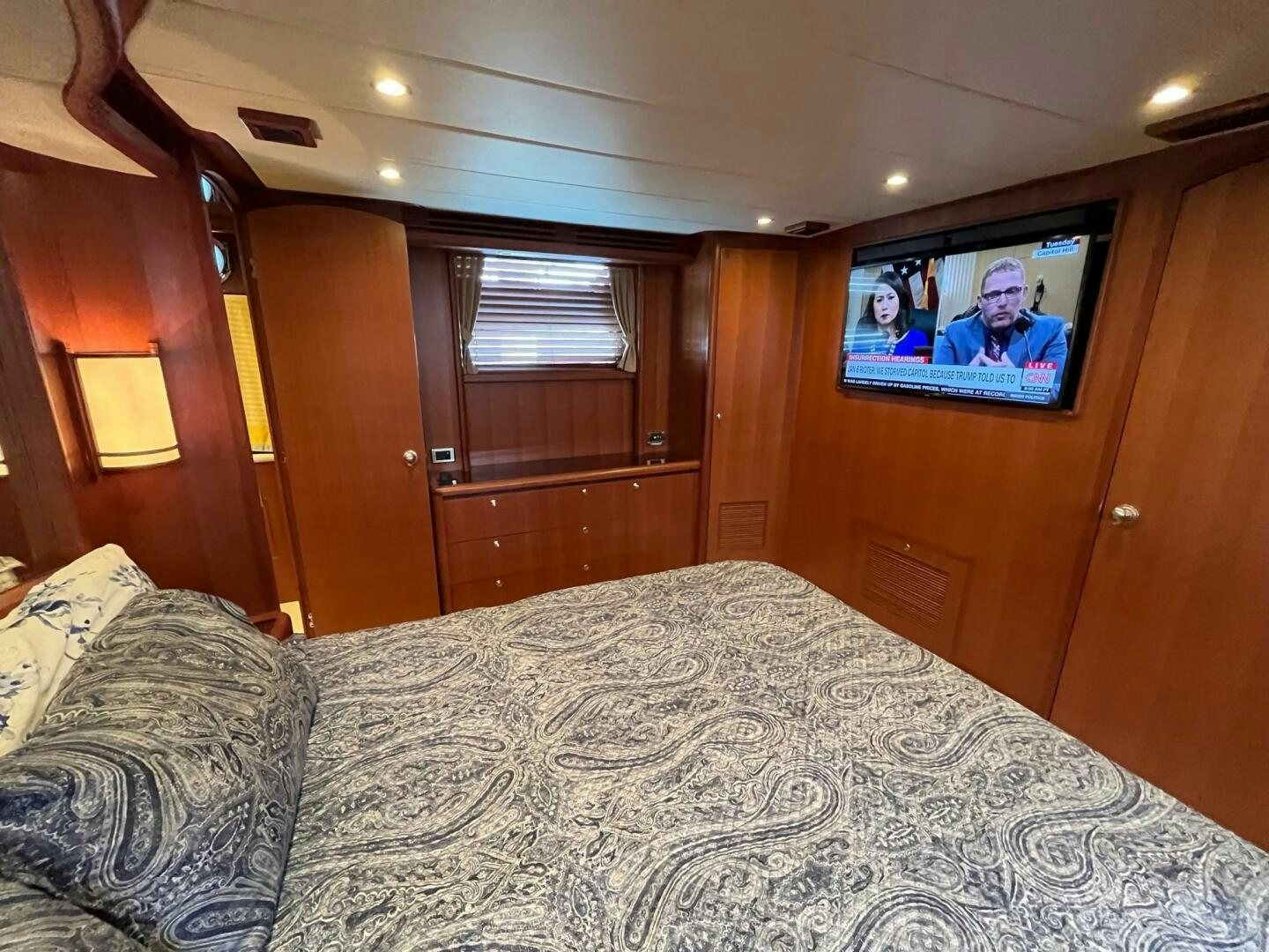 a bed with a television on the wall aboard SIG:PRN Yacht for Sale