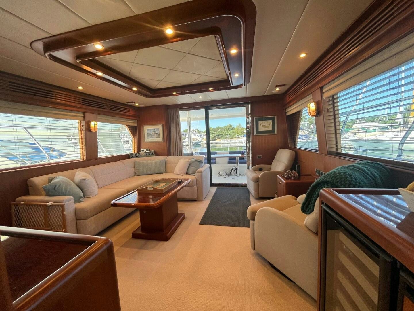 a living room with a large window aboard SIG:PRN Yacht for Sale