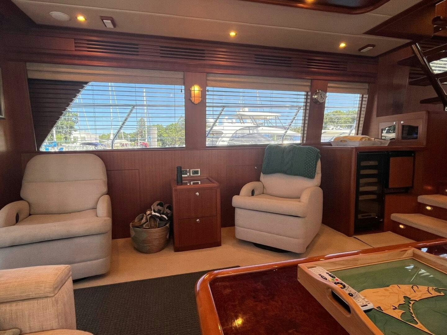 a living room with a large window aboard SIG:PRN Yacht for Sale