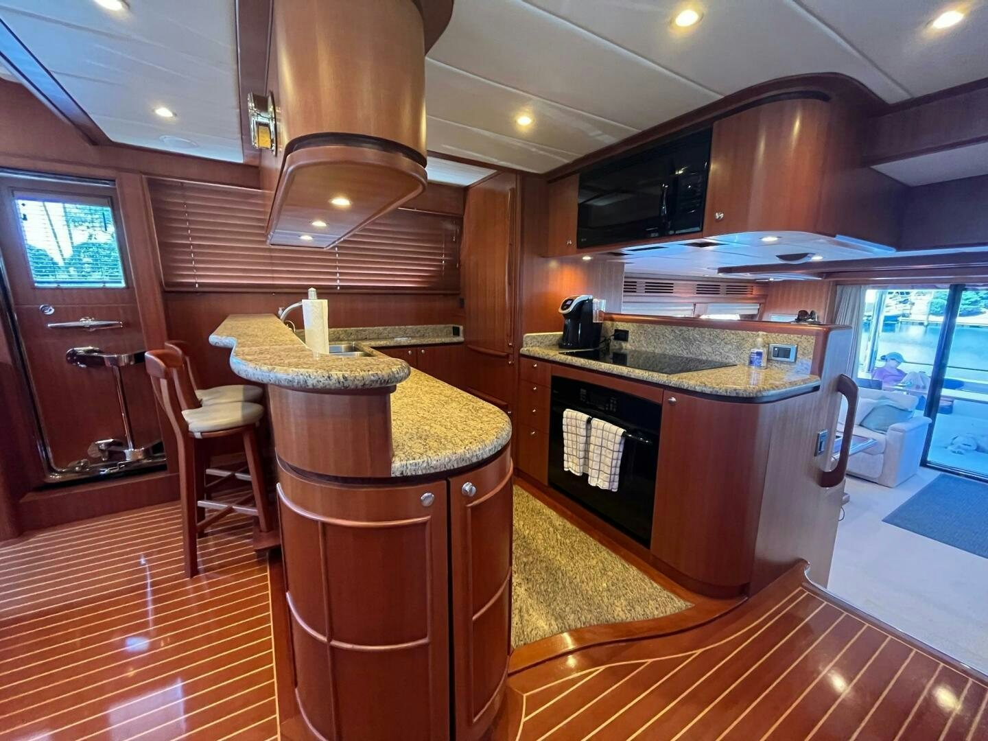 a kitchen with a bar and a table aboard SIG:PRN Yacht for Sale