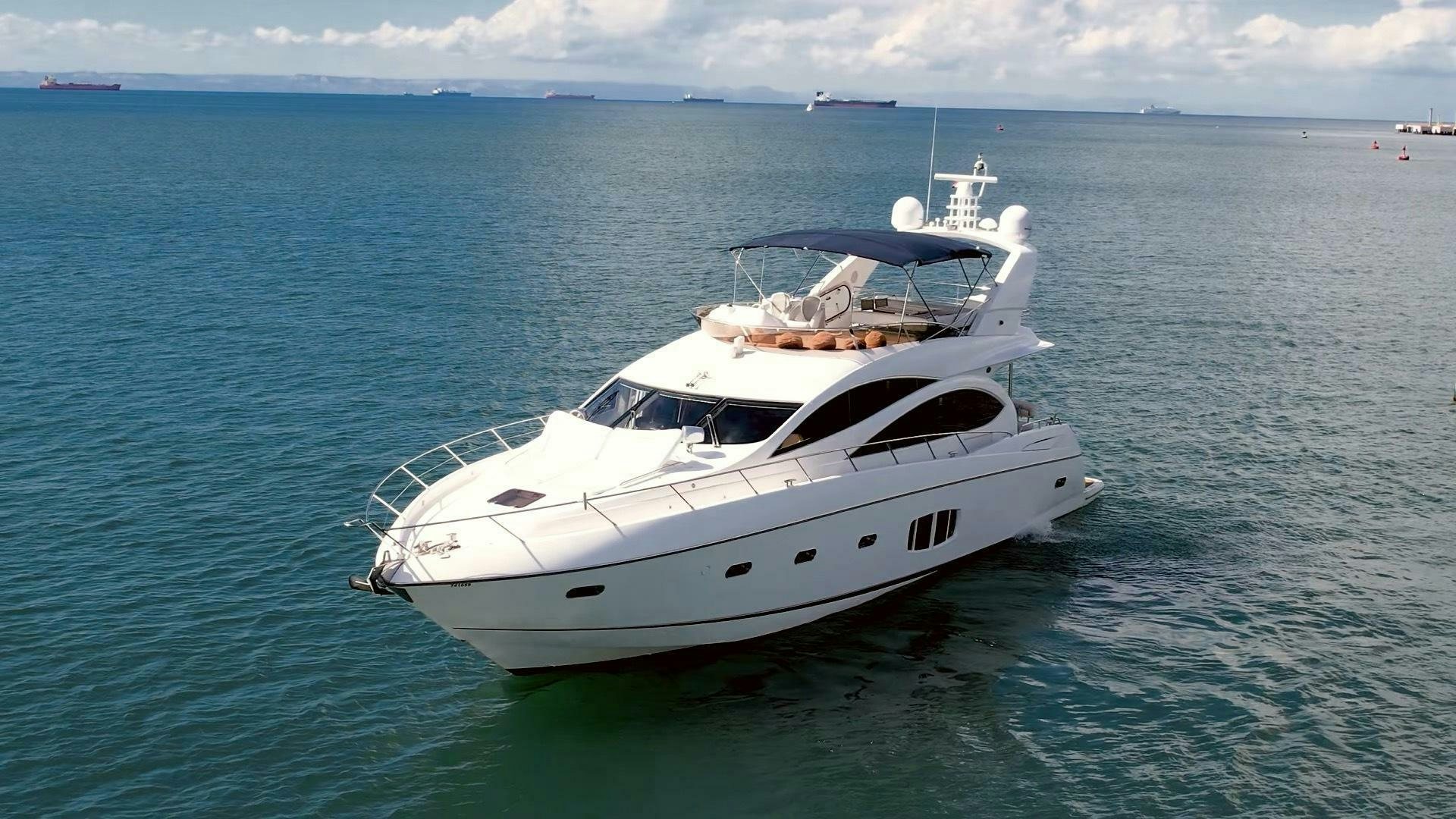 a white yacht in the water aboard BAR&CO Yacht for Sale