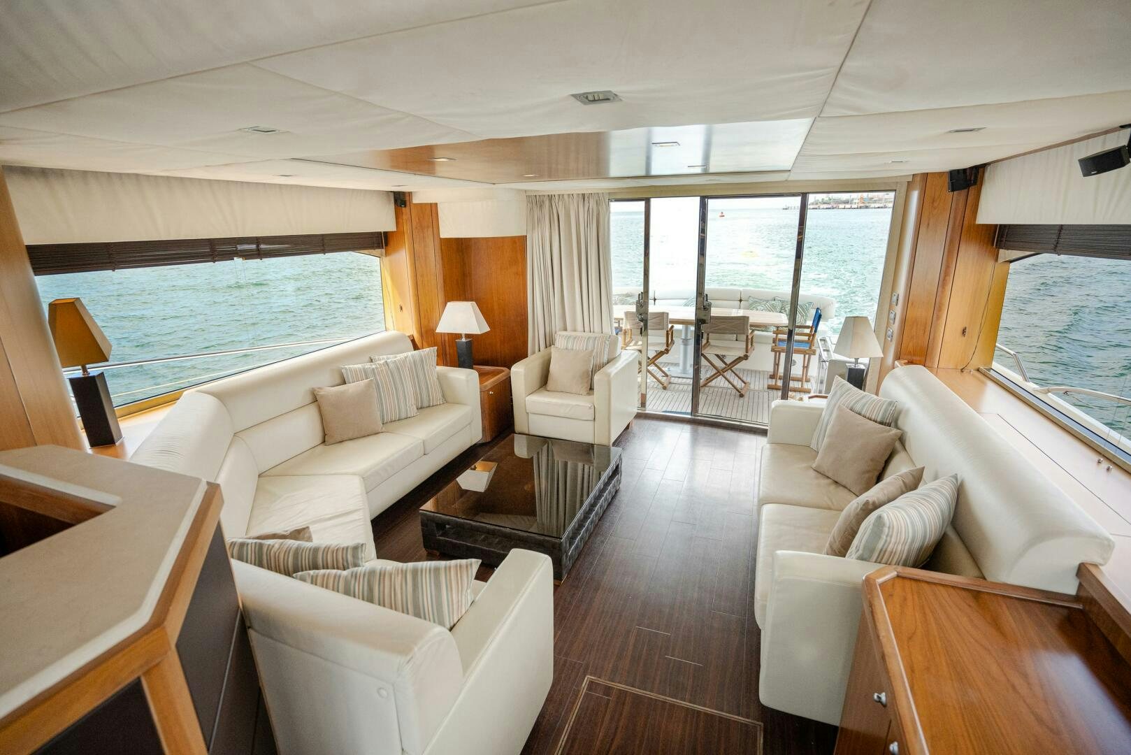 a living room with a large balcony aboard BAR&CO Yacht for Sale