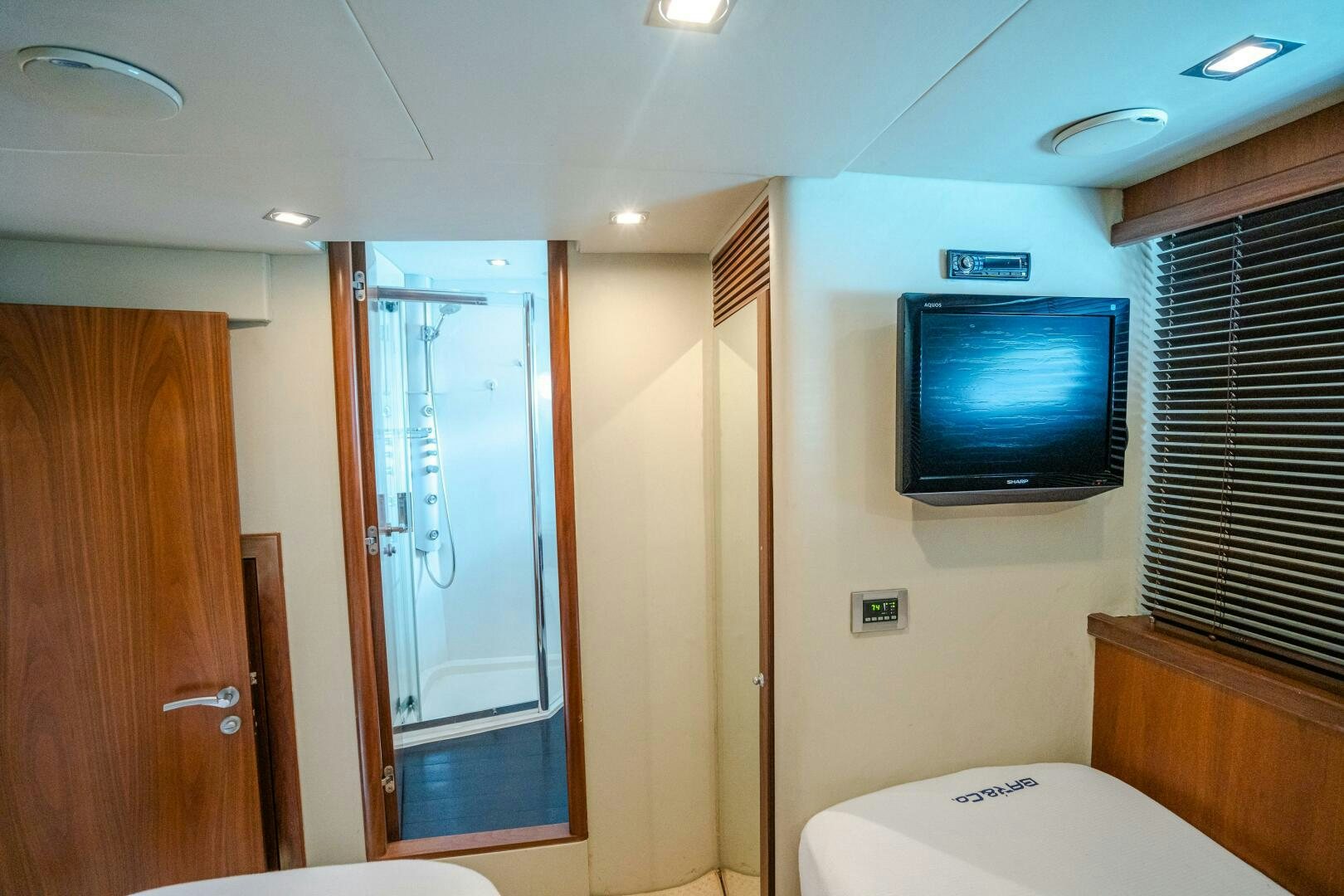 a tv on a wall in a bathroom aboard BAR&CO Yacht for Sale