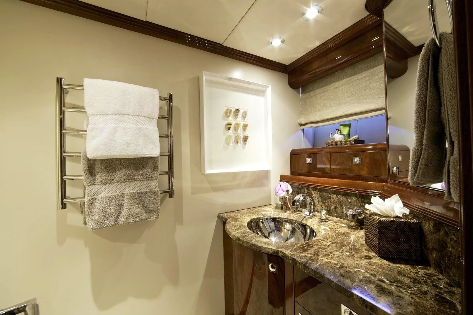 a bathroom with a sink and towels aboard DESTINATION Yacht for Sale