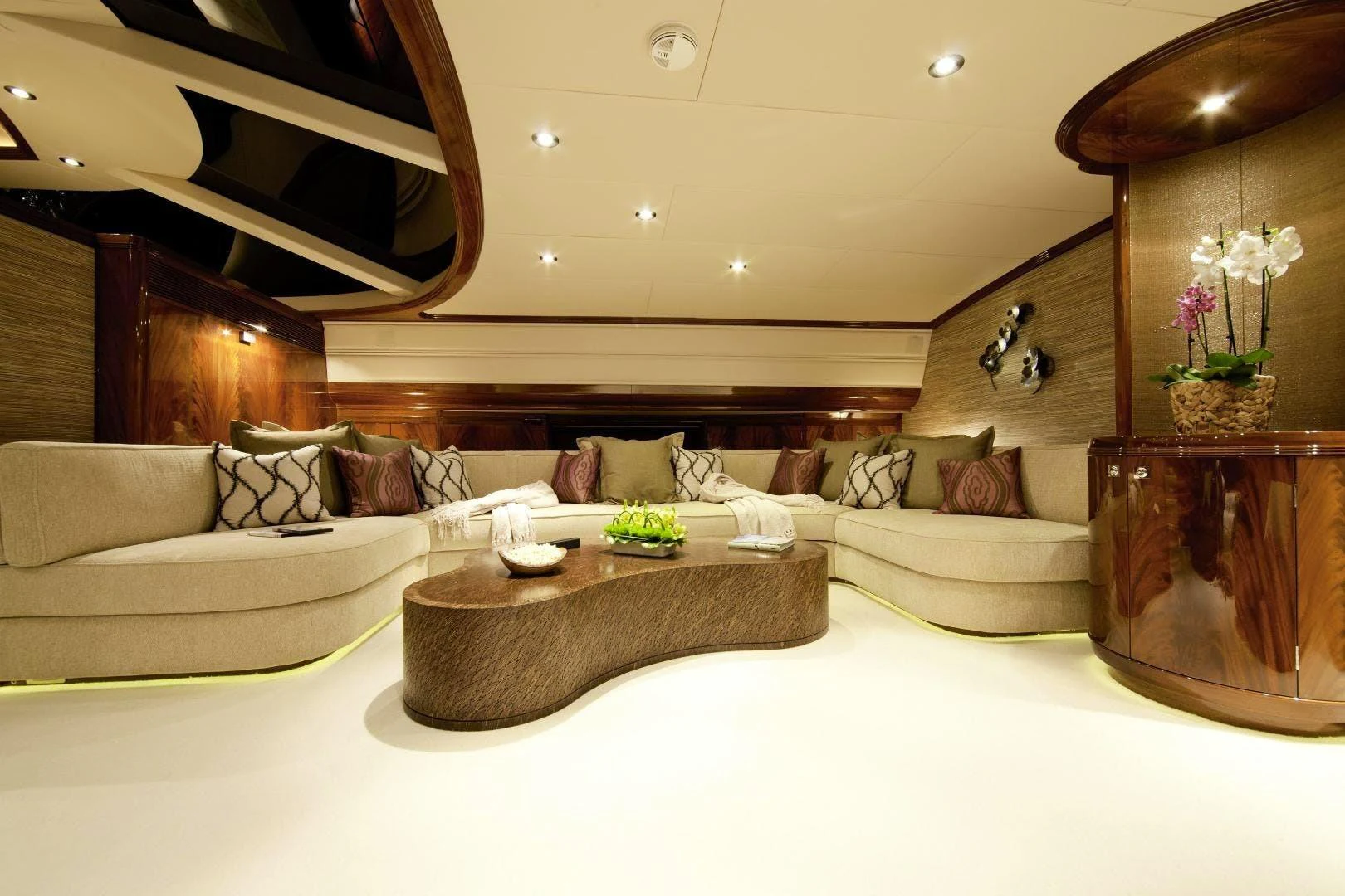 a living room with a large mirror aboard DESTINATION Yacht for Sale