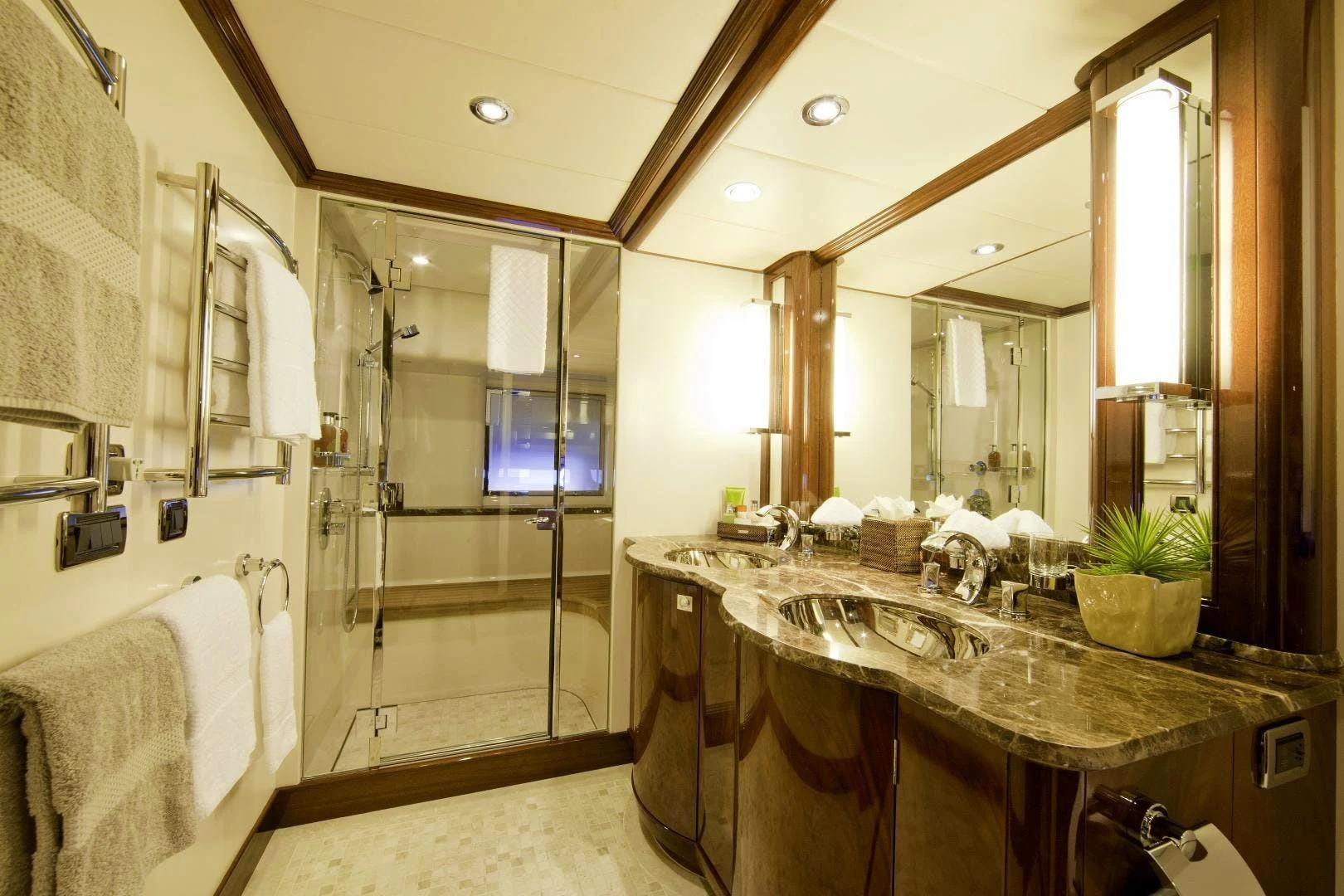 a bathroom with a large mirror aboard DESTINATION Yacht for Sale