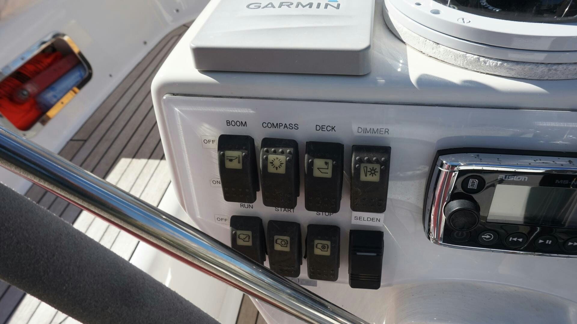 a close-up of a car stereo aboard DOLCE VITA Yacht for Sale