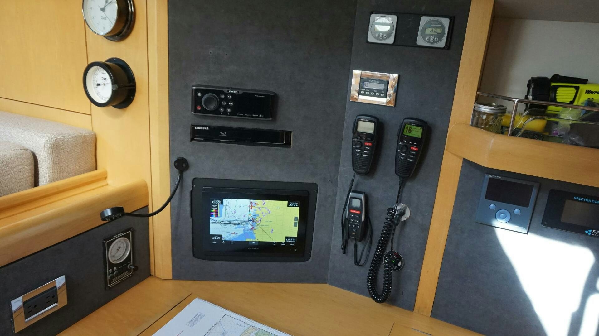 a tv and a remote control on a table aboard DOLCE VITA Yacht for Sale