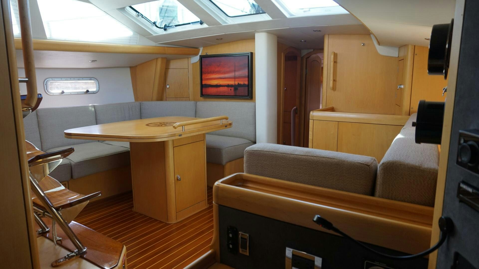 a room with a couch and a desk aboard DOLCE VITA Yacht for Sale
