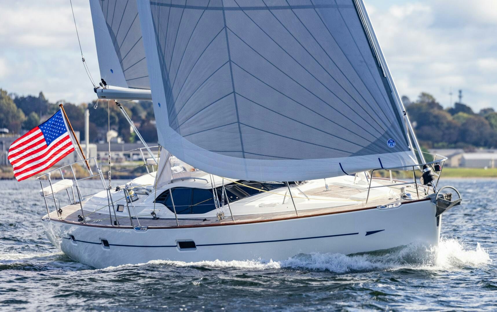 a sailboat with a flag on it aboard DOLCE VITA Yacht for Sale