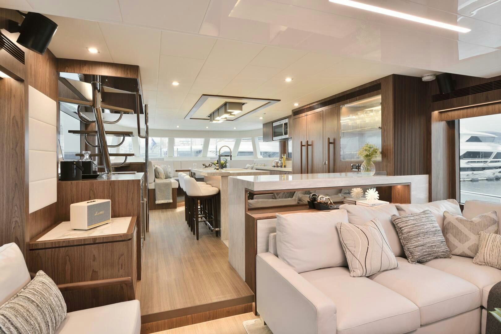 a living room with a couch and a table aboard V77S 610 Yacht for Sale