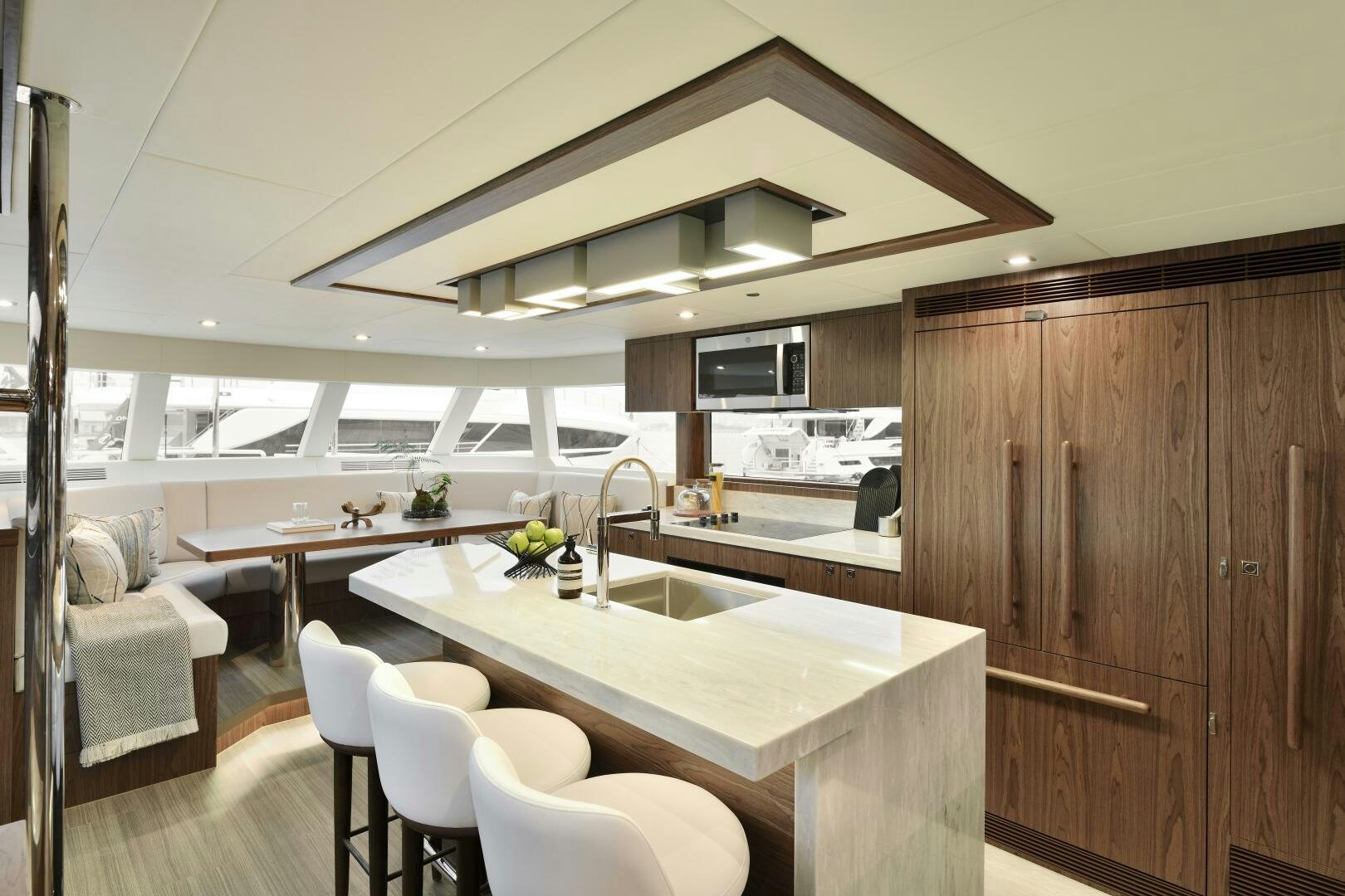 a kitchen with a table and chairs aboard V77S 610 Yacht for Sale