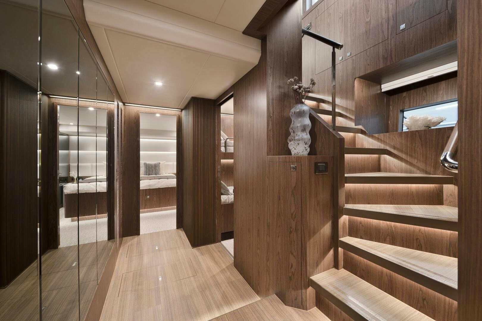 a wood staircase in a house aboard V77S 610 Yacht for Sale