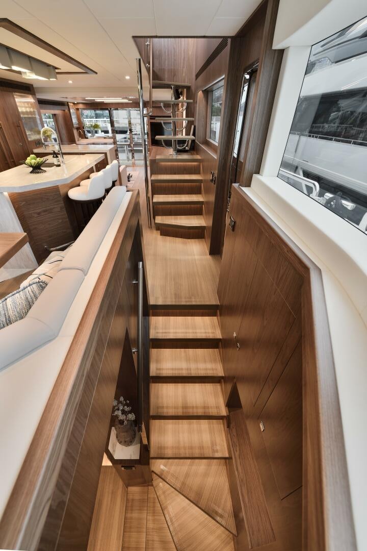 a wooden staircase in a house aboard V77S 610 Yacht for Sale
