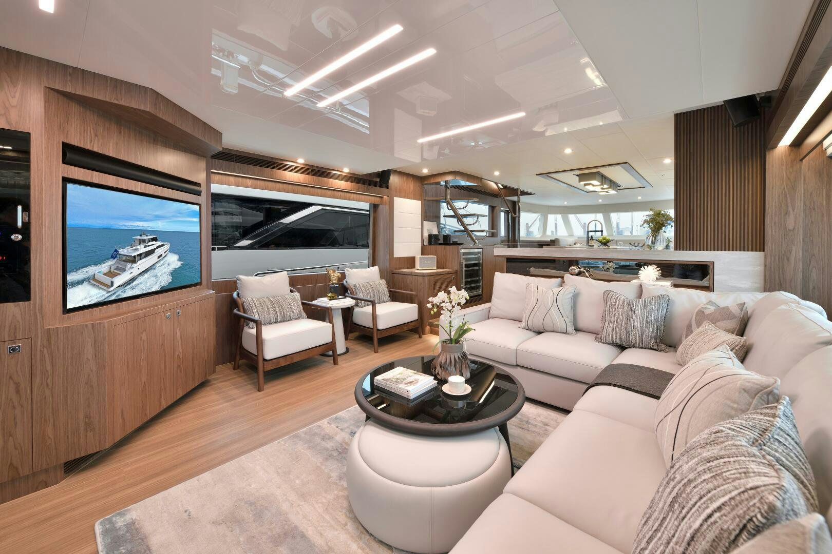 a living room with a large television aboard V77S 610 Yacht for Sale
