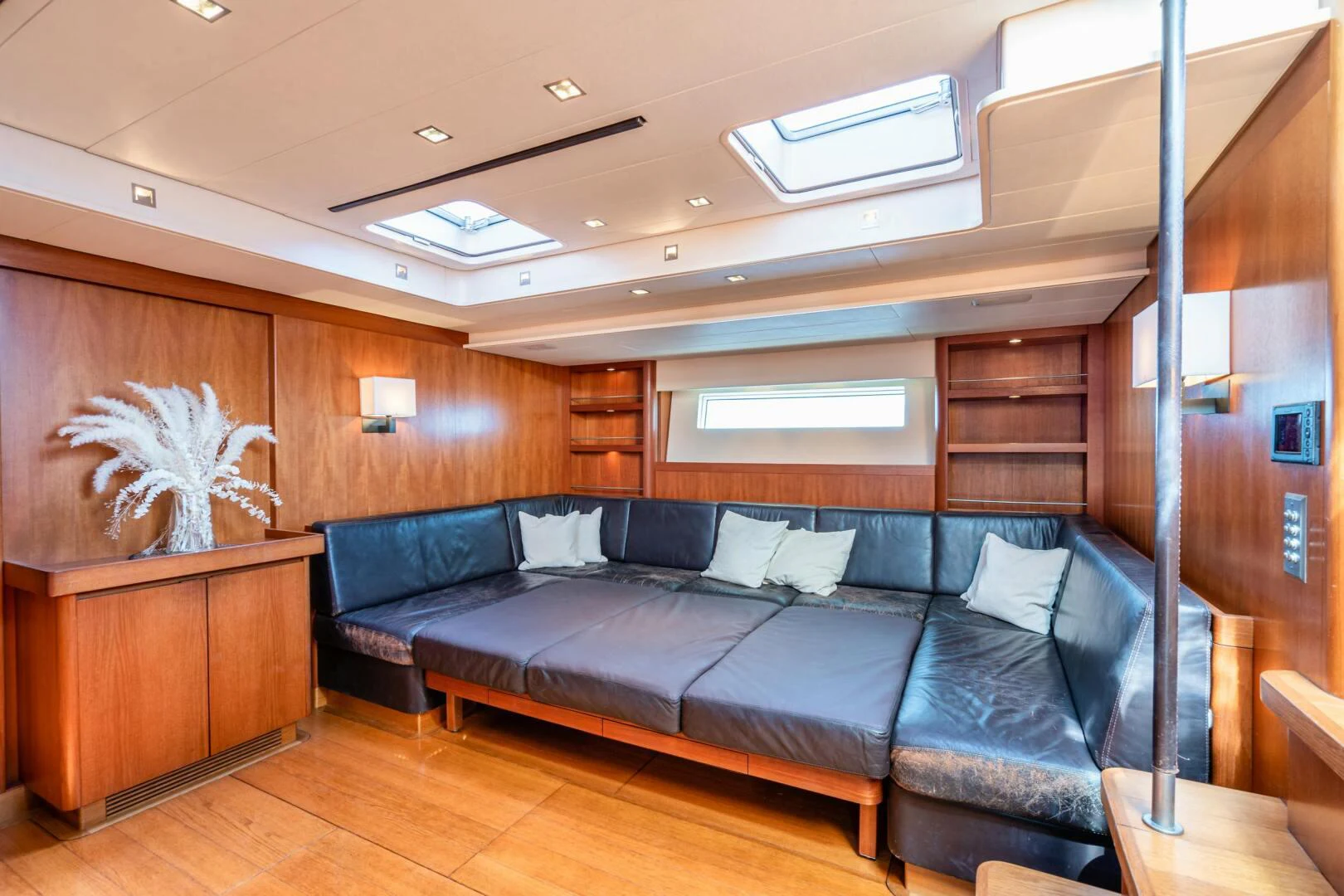 a living room with a couch aboard HOPPETOSSE Yacht for Sale
