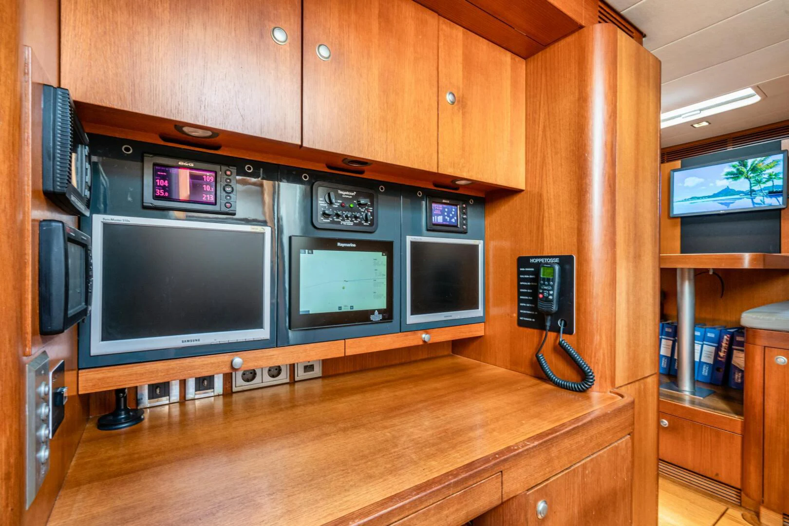 a room with many microwaves and a television aboard HOPPETOSSE Yacht for Sale