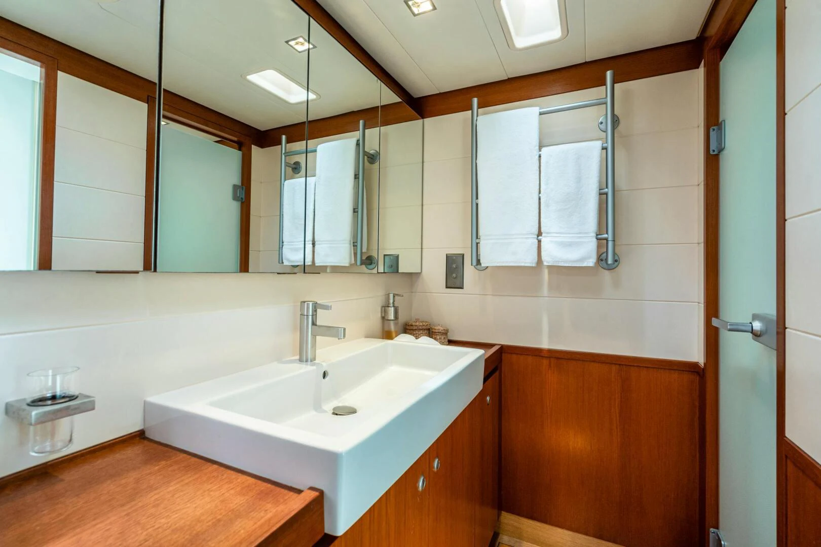 a bathroom with a large mirror aboard HOPPETOSSE Yacht for Sale