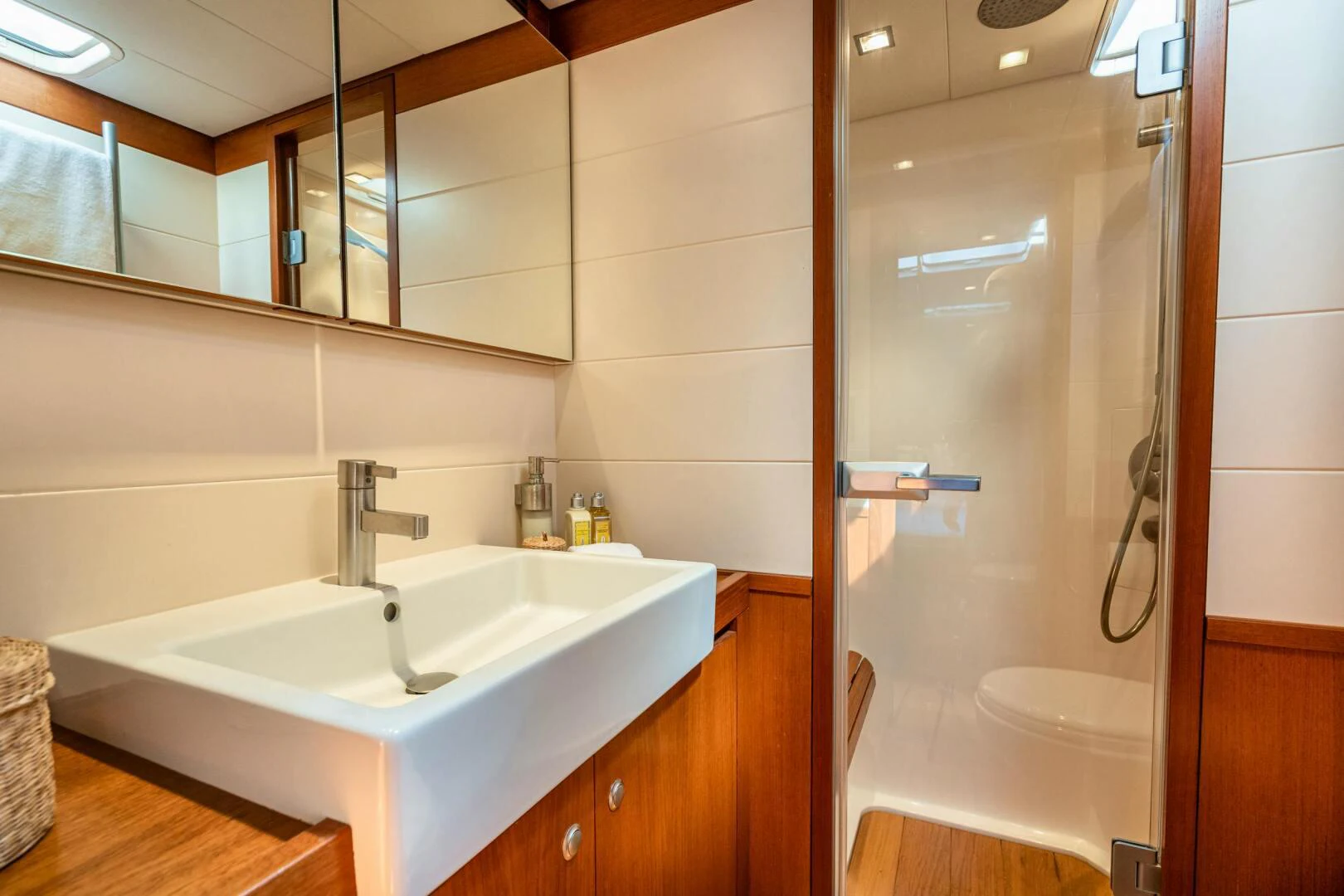 a bathroom with a sink and a shower aboard HOPPETOSSE Yacht for Sale
