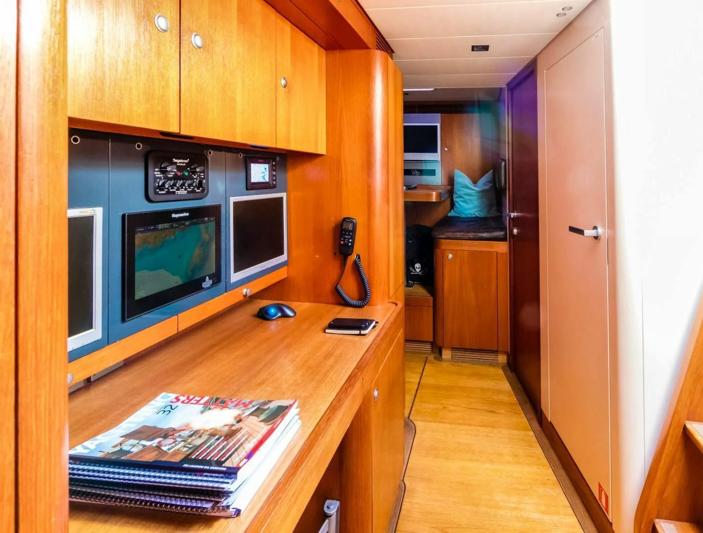 a room with a tv and a table aboard HOPPETOSSE Yacht for Sale